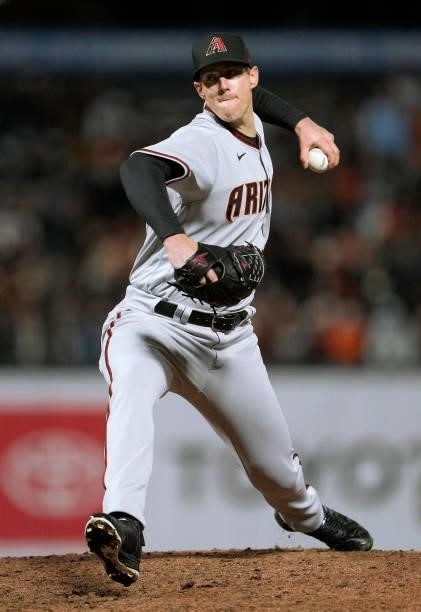 Ryan Buchter of the Arizona Diamondbacks pitches against the San Francisco Giants in the bottom of the eighth inning at Oracle Park on June 14, 2021...