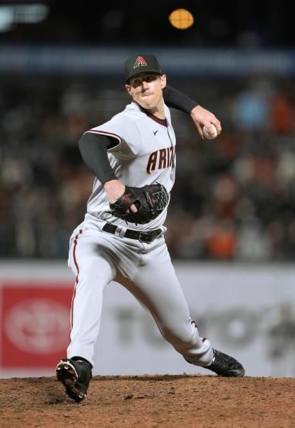 Ryan Buchter of the Arizona Diamondbacks pitches against the San Francisco Giants in the bottom of the eighth inning at Oracle Park on June 14, 2021...
