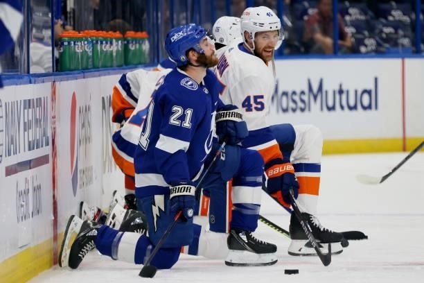 Brayden Point of the Tampa Bay Lightning talks with Braydon Coburn of the New York Islanders prior to Game Two of the Stanley Cup Semifinals in the...