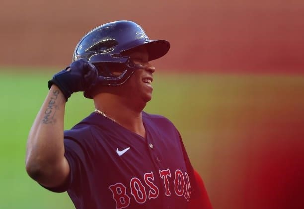 Rafael Devers of the Boston Red Sox reacts after hitting a three-run homer in the first inning against the Atlanta Braves at Truist Park on June 15,...