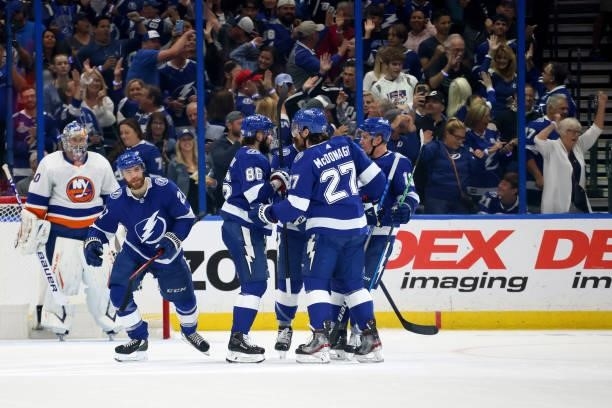 Brayden Point of the Tampa Bay Lightning celebrates with his teammates after scoring a goal on Semyon Varlamov of the New York Islanders during the...