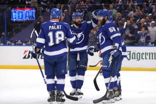 Brayden Point of the Tampa Bay Lightning celebrates with his teammates after scoring a goal on Semyon Varlamov of the New York Islanders during the...