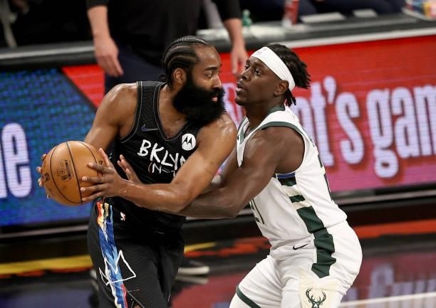 James Harden of the Brooklyn Nets tries to get past Jrue Holiday of the Milwaukee Bucks in the first quarter during game 5 of the Eastern Conference...