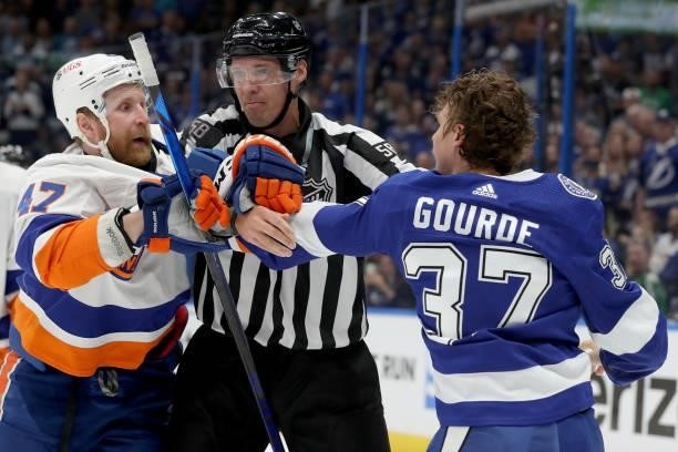 Leo Komarov of the New York Islanders fights with Yanni Gourde of the Tampa Bay Lightning during the first period in Game Two of the Stanley Cup...