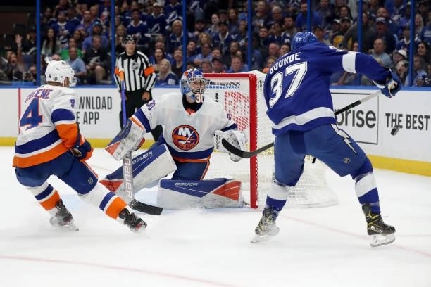 Ilya Sorokin of the New York Islanders looks for the puck against Yanni Gourde of the Tampa Bay Lightning during the first period in Game Two of the...