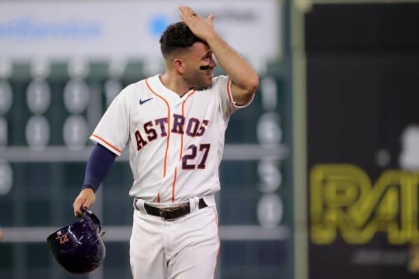 Jose Altuve of the Houston Astros watches the replay after being out during the third inning against the Texas Rangers at Minute Maid Park on June...