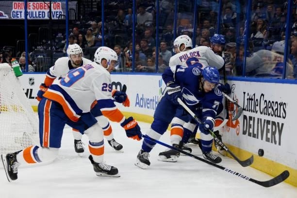 Anthony Cirelli of the Tampa Bay Lightning checks Ryan Pulock of the New York Islanders during the second period in Game Two of the Stanley Cup...