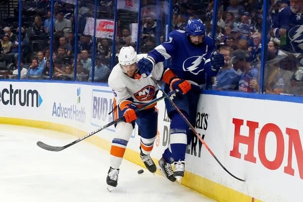 Ryan Pulock of the New York Islanders checks Alex Killorn of the Tampa Bay Lightning during the second period in Game Two of the Stanley Cup...