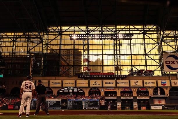 Sunset is seen outside of the stadium after storms during the third inning between the Houston Astros and the Texas Rangers at Minute Maid Park on...