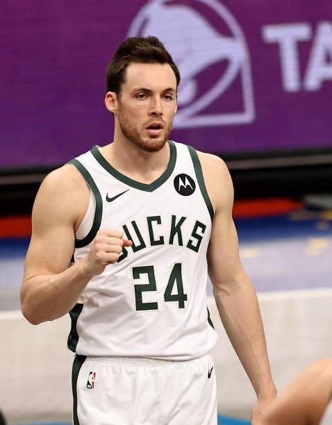 Pat Connaughton of the Milwaukee Bucks celebrates in the first half against the Brooklyn Nets during game 5 of the Eastern Conference second round at...