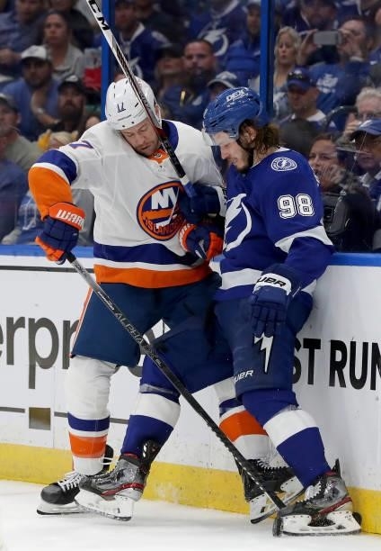 Matt Martin of the New York Islanders checks Mikhail Sergachev of the Tampa Bay Lightning during the second period in Game Two of the Stanley Cup...