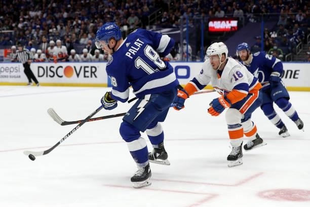 Ondrej Palat of the Tampa Bay Lightning skates with the puck against Anthony Beauvillier of the New York Islanders during the second period in Game...