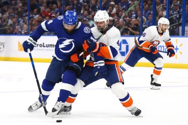 Andy Greene of the New York Islanders collides with Pat Maroon of the Tampa Bay Lightning during the second period in Game Two of the Stanley Cup...