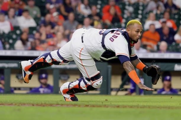 Martin Maldonado of the Houston Astros throws out Jason Martin of the Texas Rangers during the fourth inning at Minute Maid Park on June 15, 2021 in...