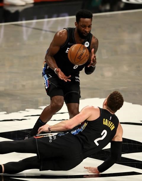 Blake Griffin of the Brooklyn Nets dives and passes a loose ball to teammate Jeff Green of the Brooklyn Nets in the second half against the Milwaukee...