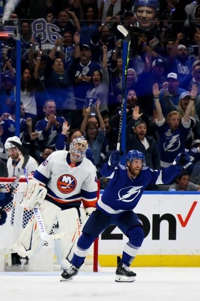 Blake Coleman of the Tampa Bay Lightning celebrates a goal scored by teammate Jan Rutta against Semyon Varlamov of the New York Islanders during the...