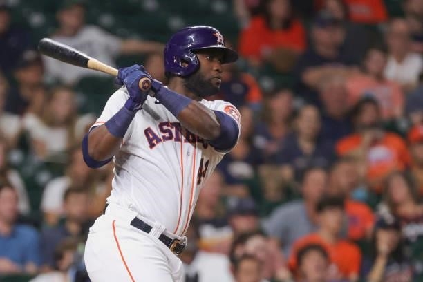 Yordan Alvarez of the Houston Astros singles to right field during the sixth inning against the Texas Rangers at Minute Maid Park on June 15, 2021 in...