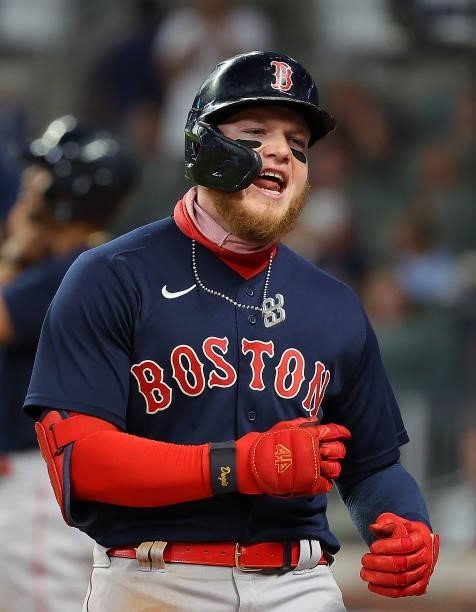 Alex Verdugo of the Boston Red Sox reacts after hitting a three-run homer in the eighth inning to break up the tie game against the Atlanta Braves at...