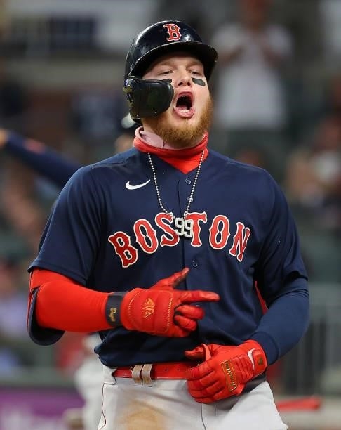 Alex Verdugo of the Boston Red Sox reacts after hitting a three-run homer in the eighth inning to break up the tie game against the Atlanta Braves at...