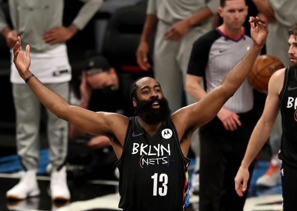 James Harden of the Brooklyn Nets plays to the fans late in the fourth quarter against the Milwaukee Bucks during game 5 of the Eastern Conference...