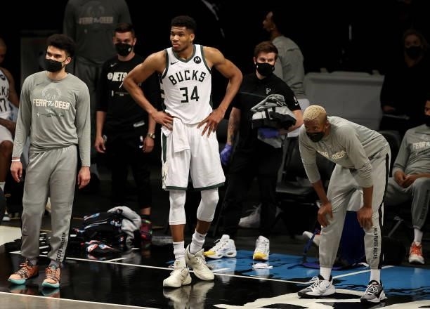 Giannis Antetokounmpo of the Milwaukee Bucks and his teammates on the bench react to the loss to the Brooklyn Nets during game 5 of the Eastern...