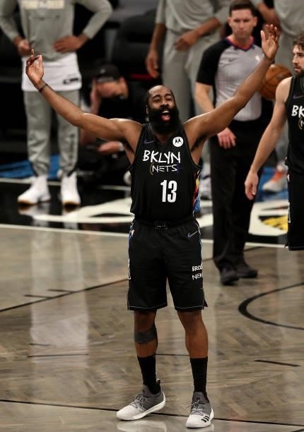 James Harden of the Brooklyn Nets plays to the fans late in the fourth quarter against the Milwaukee Bucks during game 5 of the Eastern Conference...