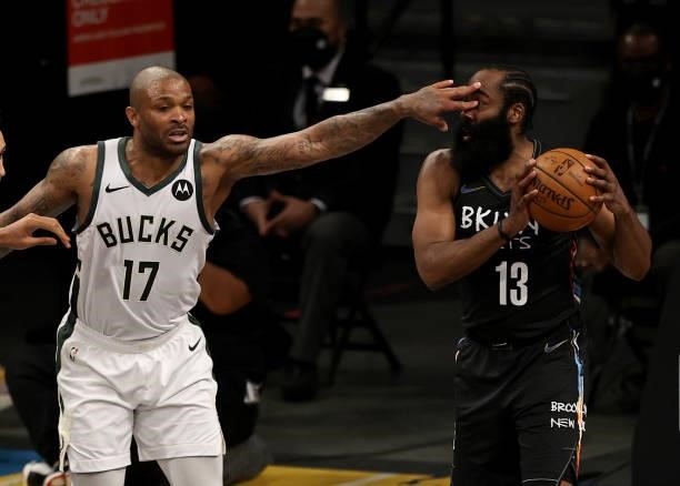 Tucker of the Milwaukee Bucks fouls James Harden of the Brooklyn Nets in the second half during game 5 of the Eastern Conference second round at...