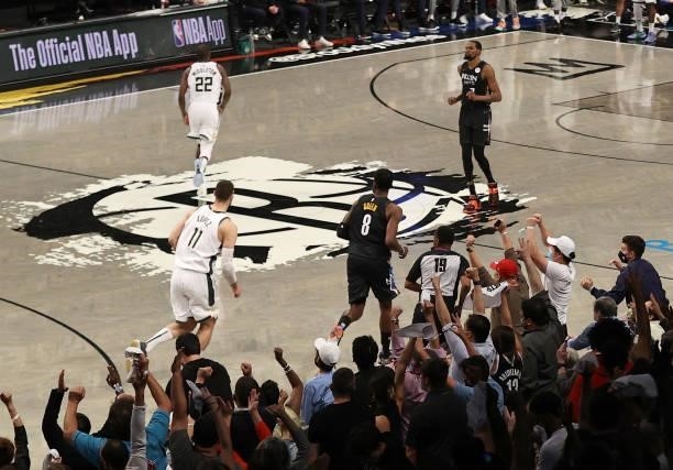 Jeff Green of the Brooklyn Nets celebrates his three with teammate Kevin Durant and the fans late in the fourth quarter against the Milwaukee Bucks...