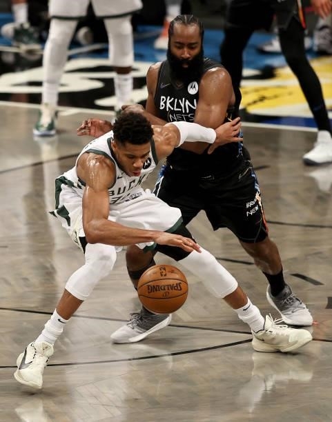 Giannis Antetokounmpo of the Milwaukee Bucks has trouble keeping the ball as James Harden of the Brooklyn Nets defends in the second half during game...