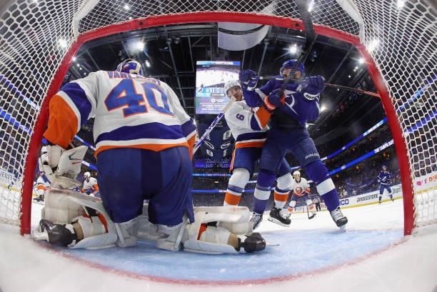 Semyon Varlamov and Ryan Pulock of the New York Islanders defend against Alex Killorn of the Tampa Bay Lightning in Game Two of the Stanley Cup...
