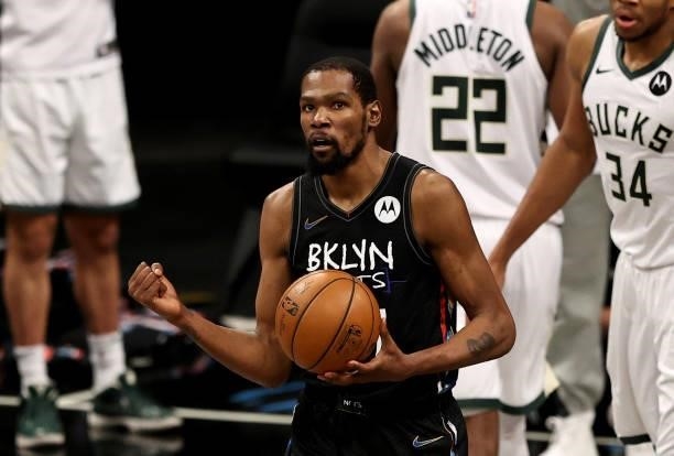 Kevin Durant of the Brooklyn Nets celebrates after the Milwaukee Bucks lose possession of the ball in the fourth quarter during game 5 of the Eastern...
