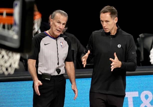 Head coach Steve Nash talks with referee Ken Mauer during game 5 of the Eastern Conference second round at Barclays Center on June 15, 2021 in the...