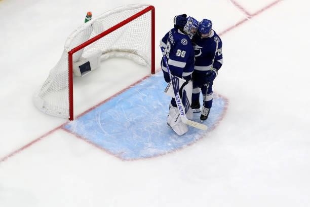 Blake Coleman and Andrei Vasilevskiy of the Tampa Bay Lightning celebrate after defeating the New York Islanders with a score of 2 to 4 in Game Two...