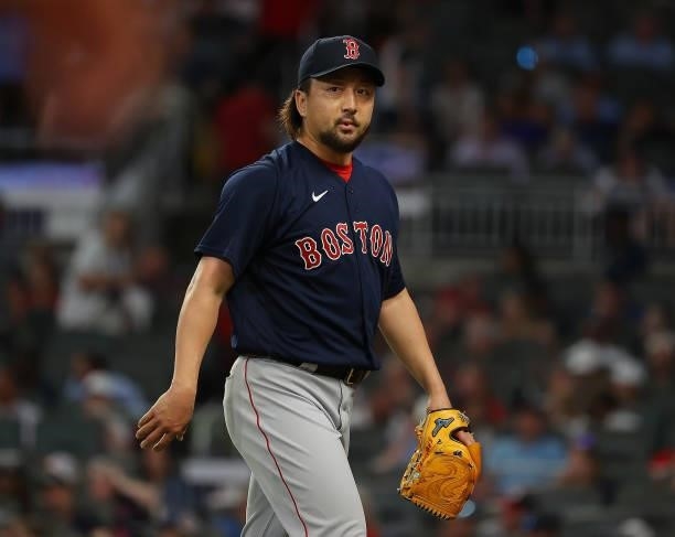 Hirokazu Sawamura of the Boston Red Sox walks off the field at the end of the seventh inning against the Atlanta Braves at Truist Park on June 15,...