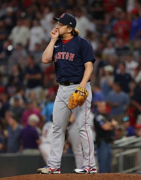Hirokazu Sawamura of the Boston Red Sox reacts during warmups in the seventh inning against the Atlanta Braves at Truist Park on June 15, 2021 in...