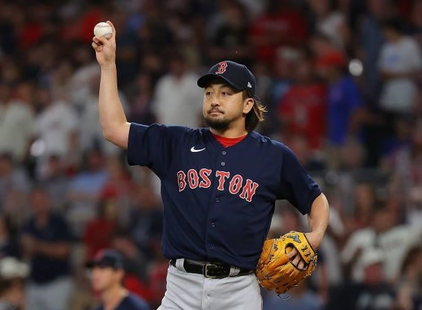 Hirokazu Sawamura of the Boston Red Sox reacts during warmups in the seventh inning against the Atlanta Braves at Truist Park on June 15, 2021 in...