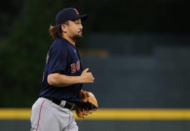 Hirokazu Sawamura of the Boston Red Sox runs onto the field to pitch in the seventh inning against the Atlanta Braves at Truist Park on June 15, 2021...