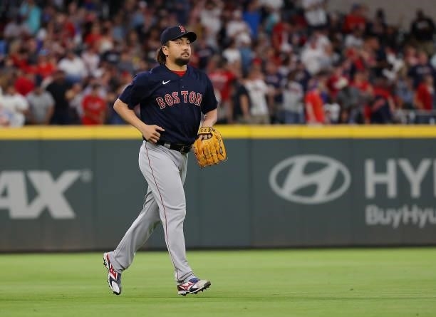 Hirokazu Sawamura of the Boston Red Sox runs onto the field to pitch in the seventh inning against the Atlanta Braves at Truist Park on June 15, 2021...