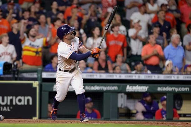 Jose Altuve of the Houston Astros hits a grand slam to defeat the Texas Rangers during the tenth inning by a score of 6-3 at Minute Maid Park on June...