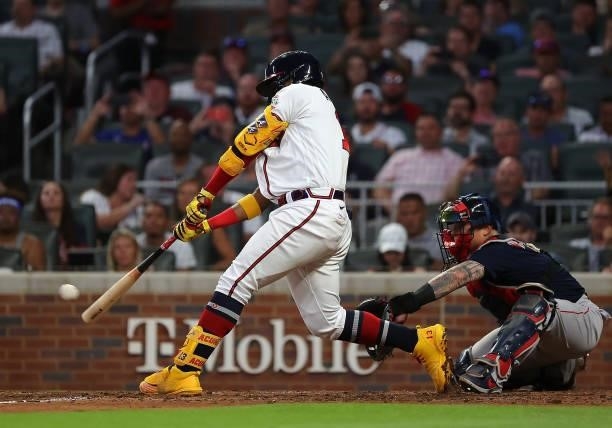 Ronald Acuna Jr. #13 of the Atlanta Braves hits a two-RBI double in the fourth inning against the Boston Red Sox and advances to third base in the...