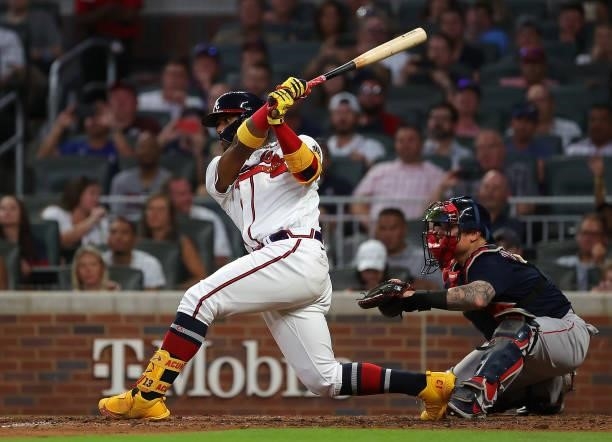 Ronald Acuna Jr. #13 of the Atlanta Braves hits a two-RBI double in the fourth inning against the Boston Red Sox and advances to third base in the...
