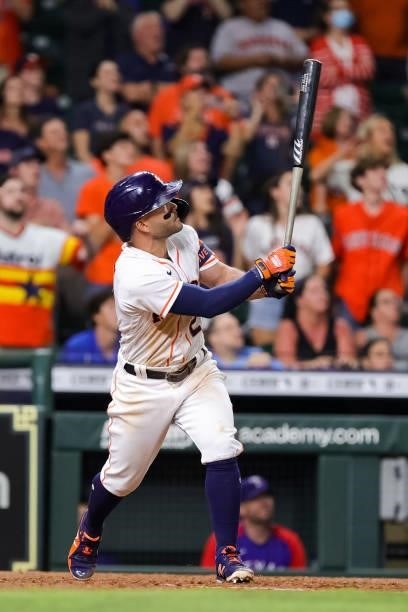 Jose Altuve of the Houston Astros hits a grand slam to defeat the Texas Rangers during the tenth inning 6-3 at Minute Maid Park on June 15, 2021 in...
