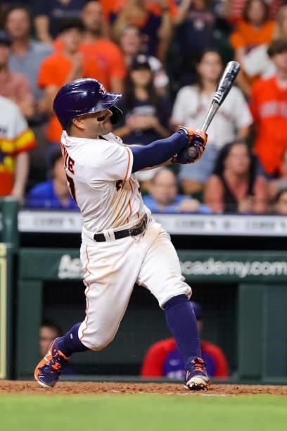 Jose Altuve of the Houston Astros hits a grand slam to defeat the Texas Rangers during the tenth inning 6-3 at Minute Maid Park on June 15, 2021 in...