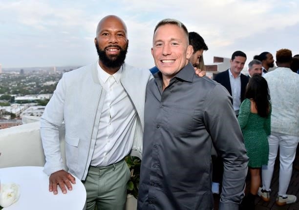 Common and Georges St-Pierre attend the Coin Cloud Cocktail Party, hosted by artist and actor Common, at Sunset Tower Hotel on June 15, 2021 in Los...