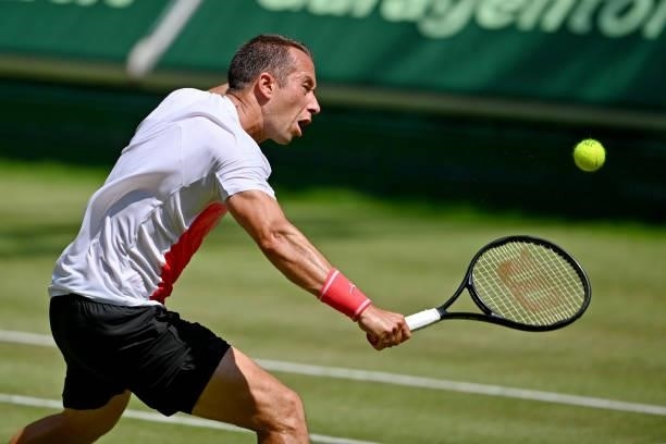 Philipp Kohlschreiber of Germany plays a backhand in his match against Corentin Moutet of France during day 5 of the Noventi Open at OWL-Arena on...
