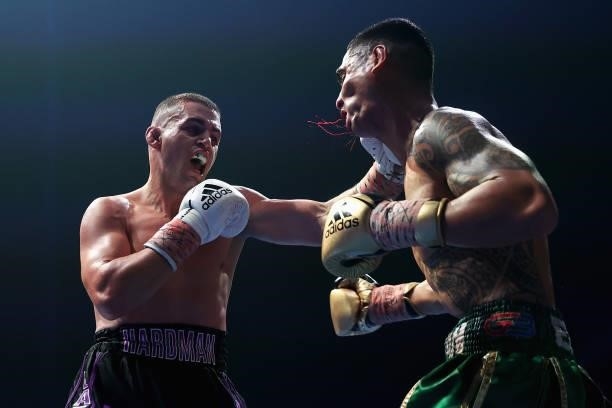 Issac Hardman punches Emmanuel Carlos during their Australian middleweight title fight at ICC Sydney on June 16, 2021 in Sydney, Australia.