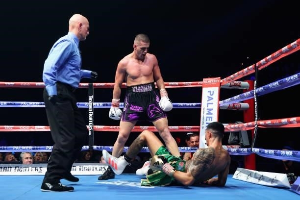 Issac Hardman punches Emmanuel Carlos during their Australian middleweight title fight at ICC Sydney on June 16, 2021 in Sydney, Australia.