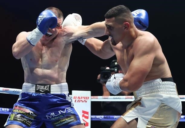 Justis Huni punches Paul Gallen during their Australian heavyweight title fight between Justis Huni and Paul Gallen at ICC Sydney on June 16, 2021 in...