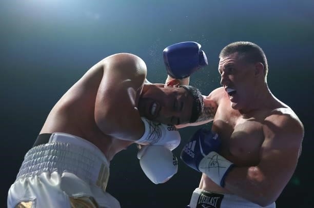 Paul Gallen punches Justis Huni during their Australian heavyweight title fight between Justis Huni and Paul Gallen at ICC Sydney on June 16, 2021 in...