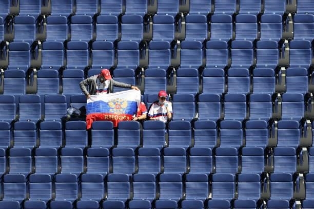 Russia fans display a flag as they take their seats prior to the UEFA Euro 2020 Championship Group B match between Finland and Russia at Saint...